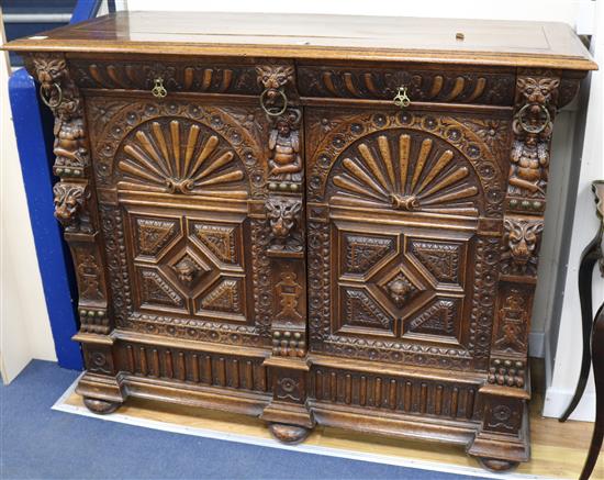 A 17th century style oak cabinet, W.141cm